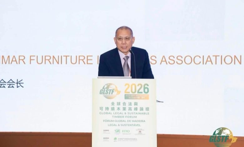 Kyaw Kyaw Win speaking at a podium at the Global Legal and Sustainable Timber Forum 2026